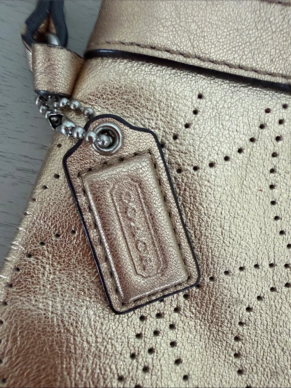 Coach wristlet metallic